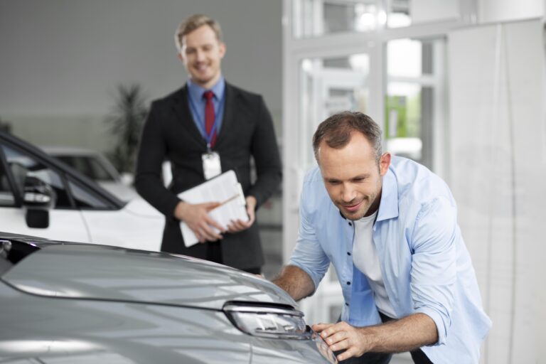 close-up-customer-with-business-person-car-dealership